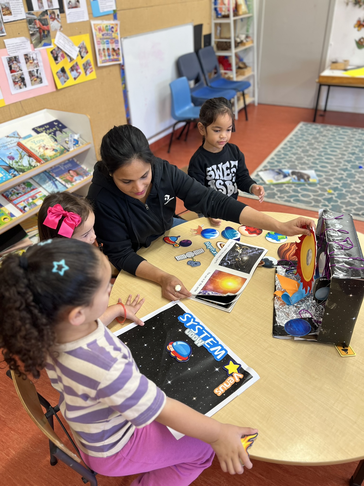 Child exploring materials during a Koru Kids activity